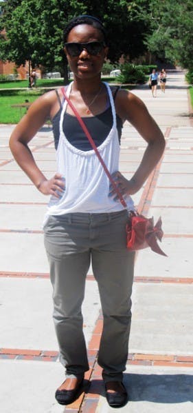 UF junior Jodine Castin goes for a chic urban look by wearing an oversized tank top with olive-colored chinos. "With the outrageous heat outside, I like to choose comfortable pieces," Castin said.