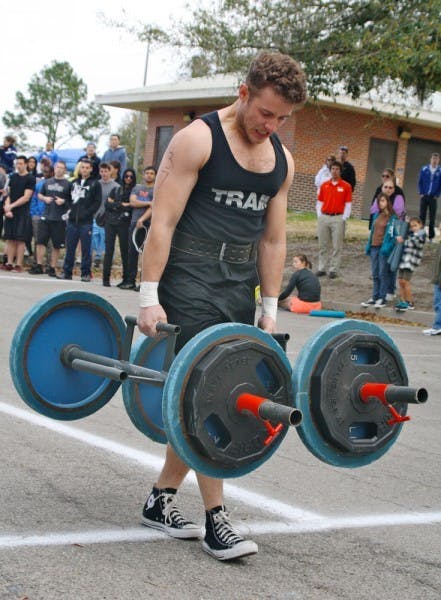 Economics junior Matthew Schaler participates in the Strong Gator competition at Maguire Field on Saturday.