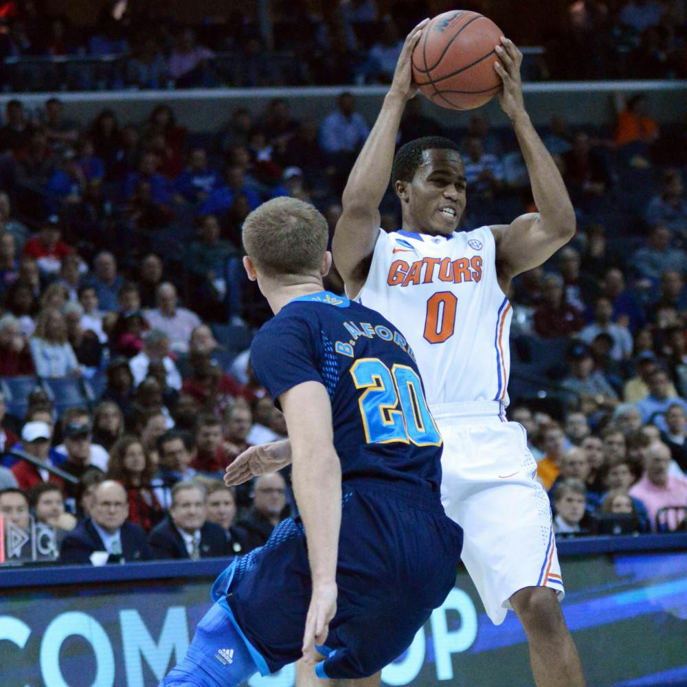 <p>Kasey Hill looks to pass the ball during Florida's 79-68 win over UCLA on Thursday in the FedEx Forum in Memphis, Tenn. Hill recorded a game-high 10 assists against the Bruins.</p>