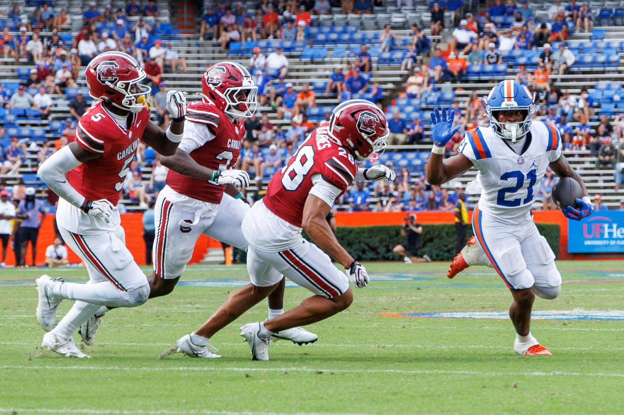 Florida running back Evan Pryor (21) attempts to make it to the end zone during the second half of an NCAA college football game against South Carolina, Saturday, Oct. 10, 2026, in Gainesville, Fla.