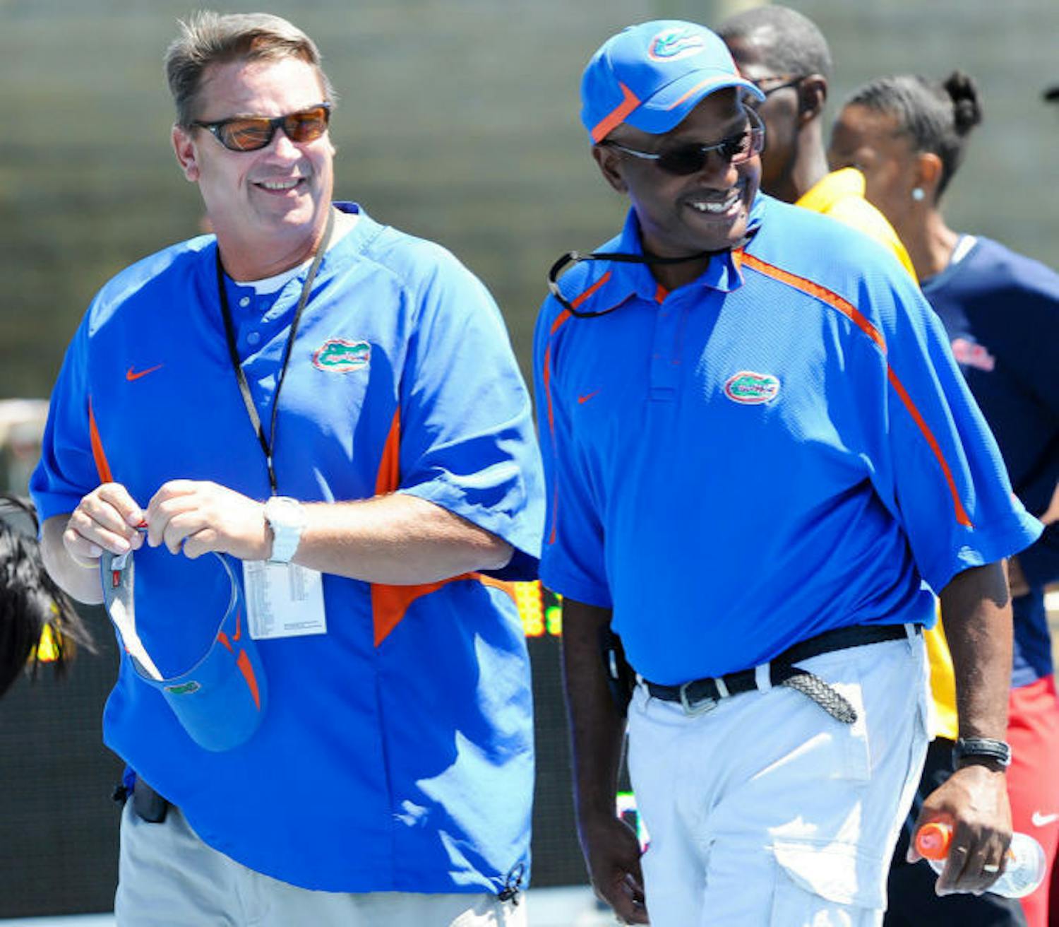 Throwers coach Steve Lemke (left) and coach Mike Holloway walk across the field at Percy Beard Track at Pressly Stadium during the 2012 Florida Relays. Seventeen Gators qualified Sunday for the NCAA Outdoor Championships, which are set to begin June 5.&nbsp;