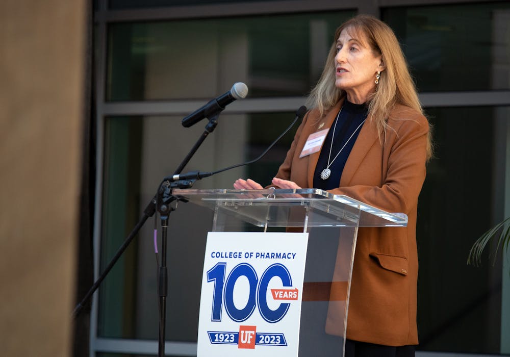 <p>Michele Weizer, the division director of pharmacy operations for HCA East Florida, gives an address to the audience of faculty, students and supporters for the UF College of Pharmacy Centennial Kickoff celebration Thursday, Jan. 26, 2023.</p>