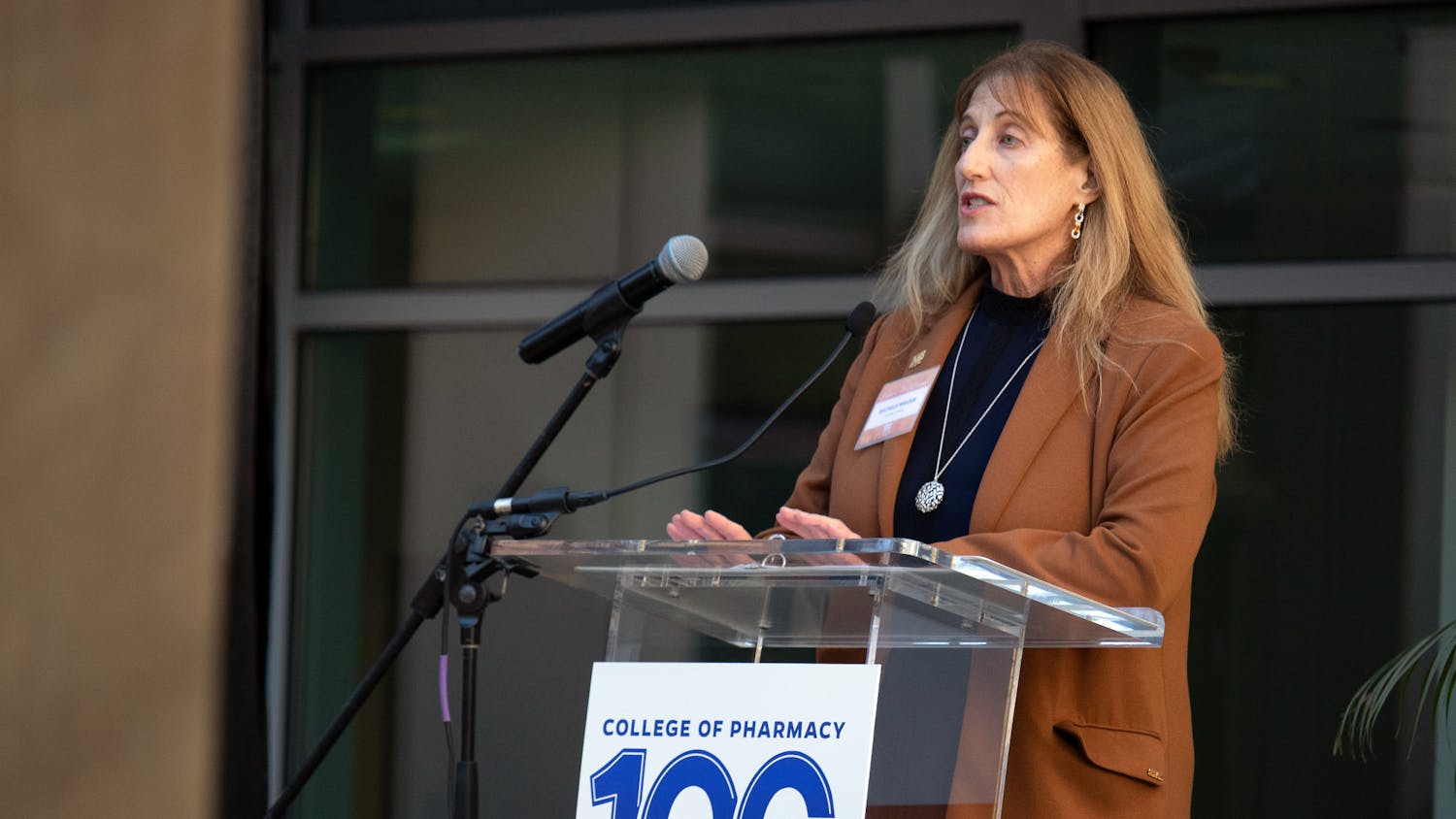 Michele Weizer, the division director of pharmacy operations for HCA East Florida, gives an address to the audience of faculty, students and supporters for the UF College of Pharmacy Centennial Kickoff celebration Thursday, Jan. 26, 2023.