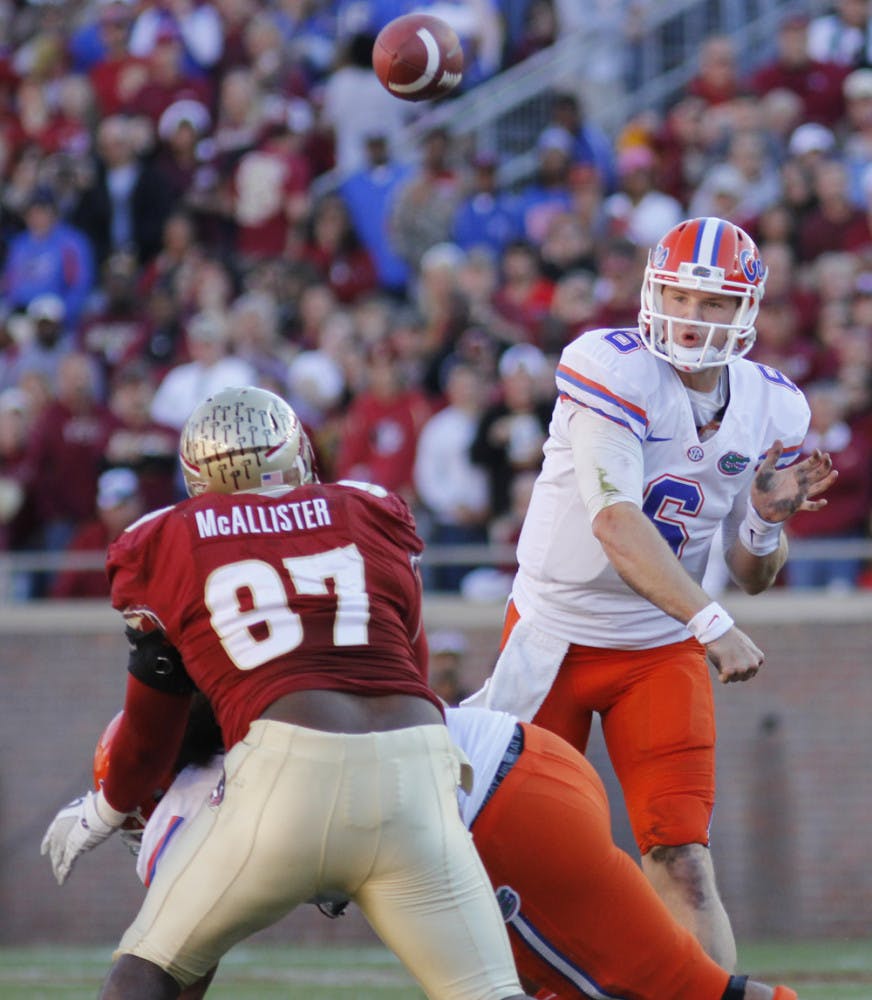 Jeff Driskel (6) fires a pass over FSU’s Demonte McAllister (97) during UF’s 37-26 win on Nov. 24. Driskel is expected to be UF’s starting quarterback.