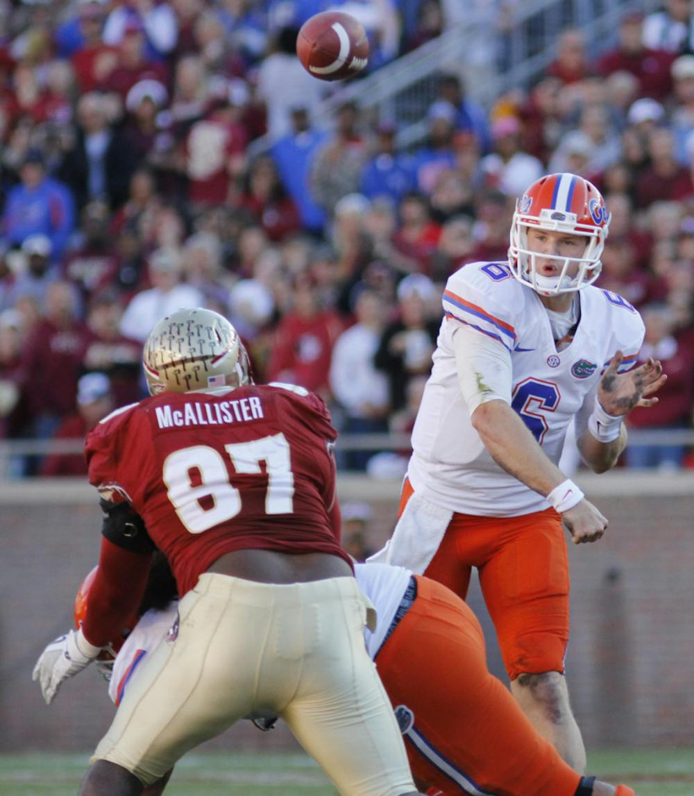 <p>Jeff Driskel (6) fires a pass over FSU’s Demonte McAllister (97) during UF’s 37-26 win on Nov. 24. Driskel is expected to be UF’s starting quarterback.</p>