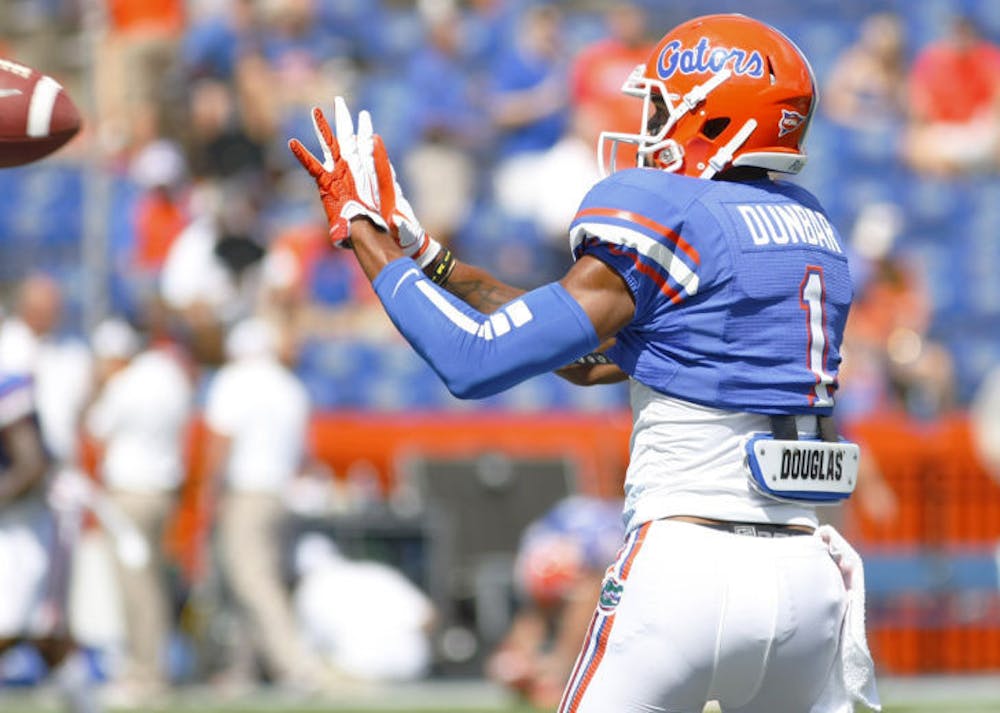 <p align="justify">Quinton Dunbar reaches for a pass during warm-ups prior to Florida’s game against Kentucky on Sept. 22 in Ben Hill Griffin Stadium. The Gators defeated the Wildcats 38-0.</p>