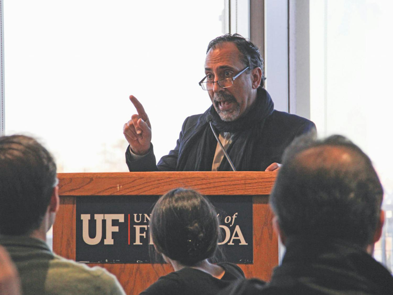 Leonardo A. Villalón, the dean of the UF international center, addresses those who are concerned about the president’s new travel ban in the Arredondo Café at the Reitz Union on Monday afternoon. “Your lives are very much affected by this,” Villalón told the crowd of about 100 in attendance. 