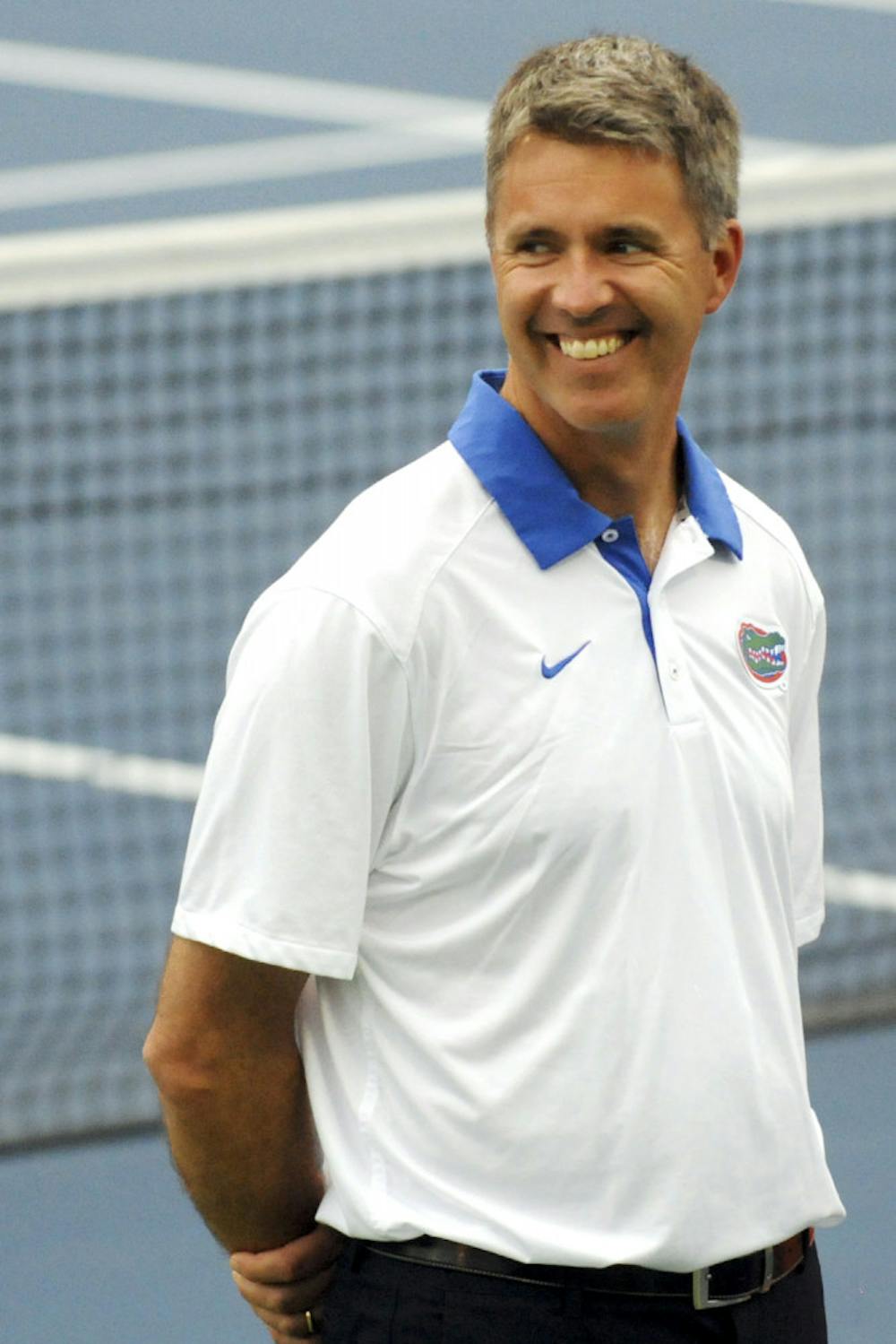 <p>UF women’s tennis coach Roland Thornqvist smiles during introductions prior to Florida’s win over USF on Jan. 27, 2016, at the Ring Tennis Complex.</p>