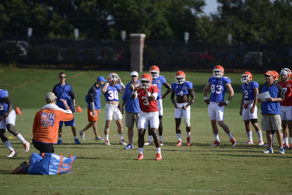 <p class="p1">Treon Harris takes a snap during practice on Aug. 14 at Donald R. Dizney Stadium. Harris was named Florida's backup quarterback on Tuesday.</p>