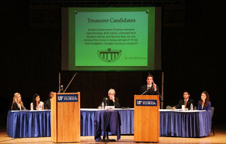 Students Party treasurer candidate Billy Farrell speaks at the UF Student Government debate Wednesday night. Professor Mike Foley served as the debate moderator.