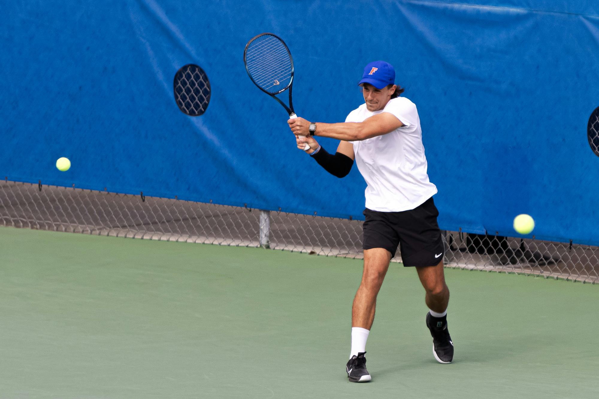 Florida graduate student JanMagnus Johnson rips a backhand in the Gators’ 7-0 win against The Citadel on Jan. 19, 2024.