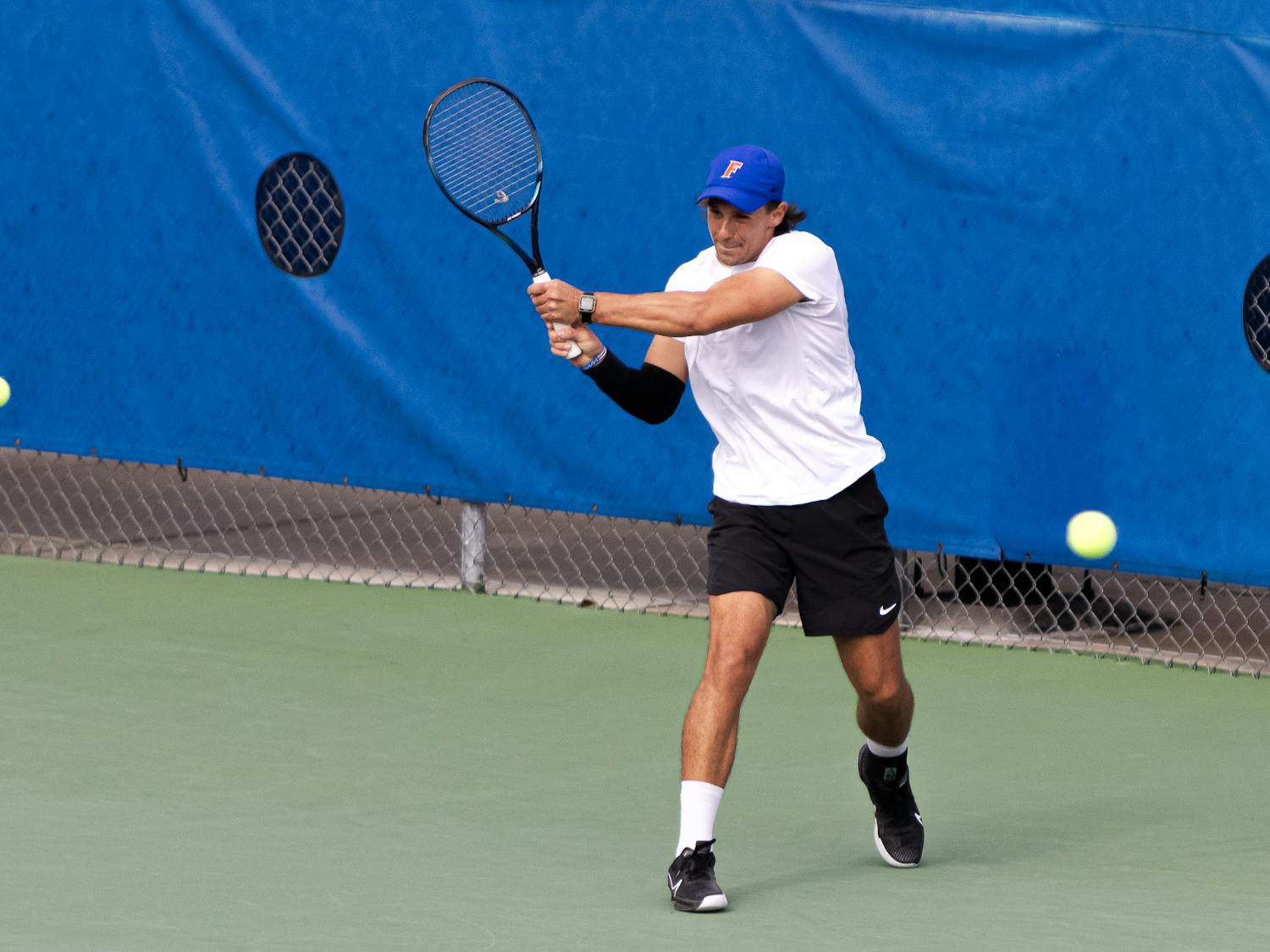 Florida graduate student JanMagnus Johnson rips a backhand in the Gators’ 7-0 win against The Citadel on Jan. 19, 2024.