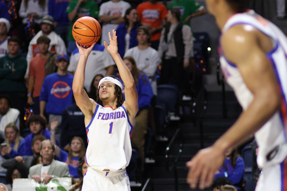 Florida junior guard Walter Clayton Jr. shoots the ball in the Gators' 77-57 win against the Merrimack Warriors on Tuesday, Dec. 5, 2023. 