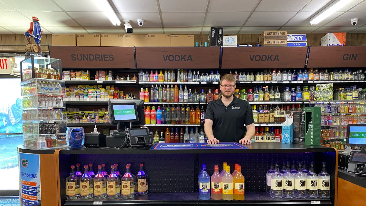 Andrew Pentland stands behind the counter at Gator Beverage ﻿Monday morning. 