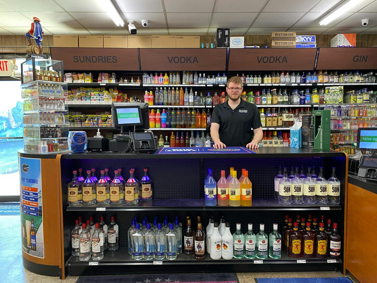 Andrew Pentland stands behind the counter at Gator Beverage ﻿Monday morning. 