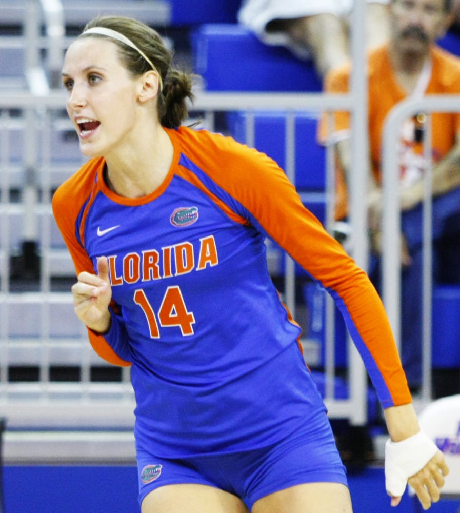Senior Betsy Smith (14) celebrates after scoring a point during the FAMU match at Stephen C. O'Connell Center on Aug. 25. Her experience has helped carry Florida to an 8-2, 2-0 SEC record.