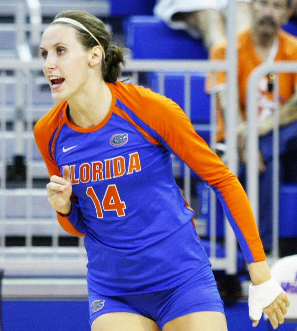 <p>Senior Betsy Smith (14) celebrates after scoring a point during the FAMU match at Stephen C. O'Connell Center on Aug. 25. Her experience has helped carry Florida to an 8-2, 2-0 SEC record.</p>