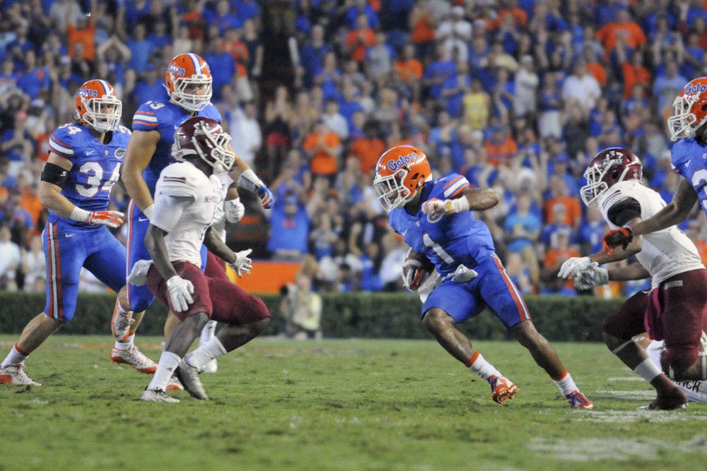 <p dir="ltr" align="justify">UF cornerback Vernon Hargreaves III returns an interception during Florida’s 61-13 win against New Mexico State on Saturday at Ben Hill Griffin Stadium.</p>