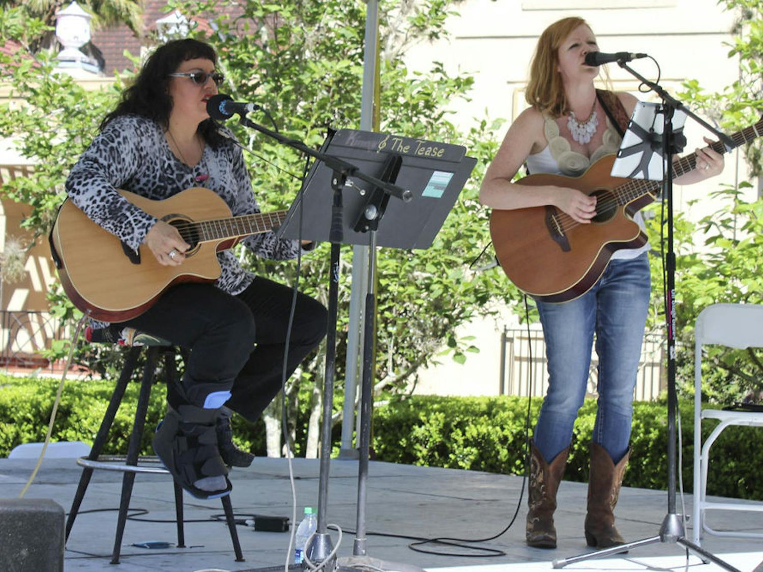 Kim LeCouteur and Amber Waters perform as the duo Damaged Daughters in the gardens of the Historic Thomas Center on Sunday during the Santa Fe Spring Arts Festival. Damaged Daughters is a folk/americana duo based out of Gainesville that performs throughout North Central Florida.