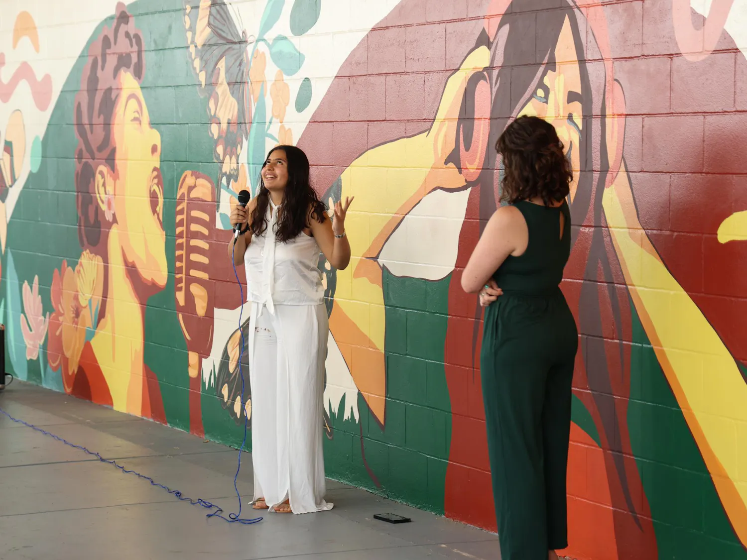 Isabela Perez Thomas, a junior at Eastside High School, talks about her experience helping with the mural at the unveiling in Gainesville, Fla. on Tuesday March 31, 2026.