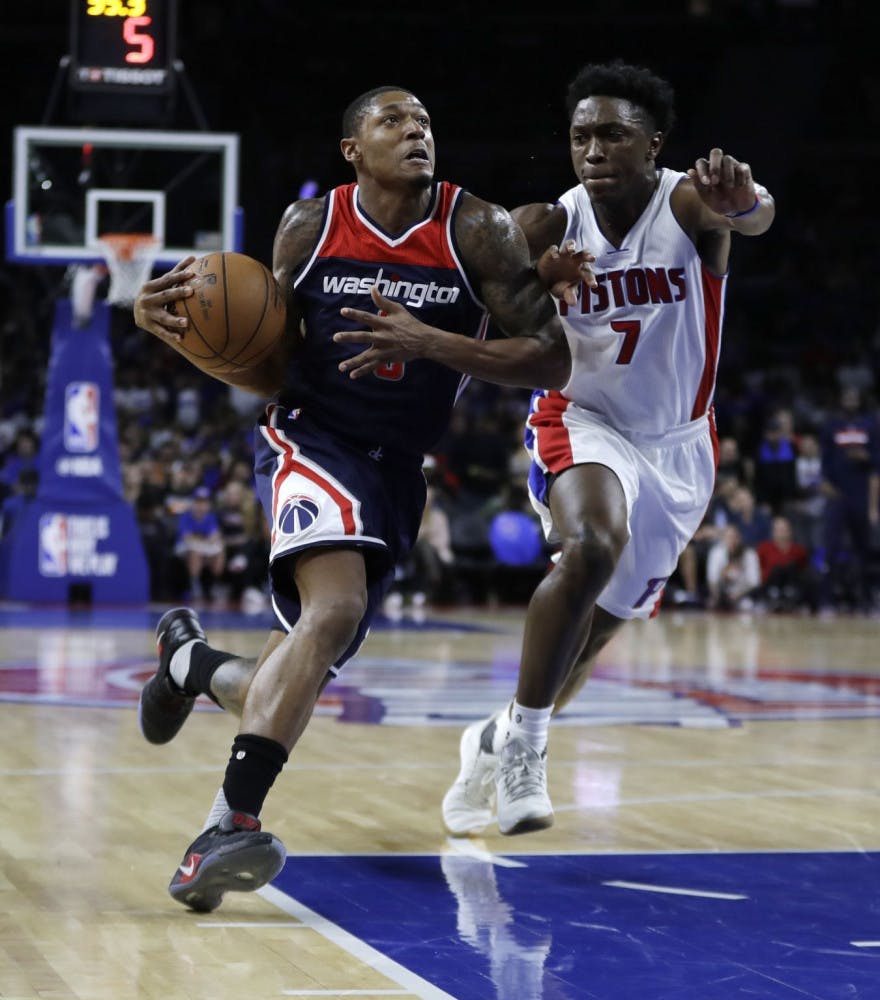 Washington Wizards guard Bradley Beal (3) drives on Detroit Pistons forward Stanley Johnson (7) during second half of an NBA basketball game, Monday, April 10, 2017, in Auburn Hills, Mich. (AP Photo/Carlos Osorio)