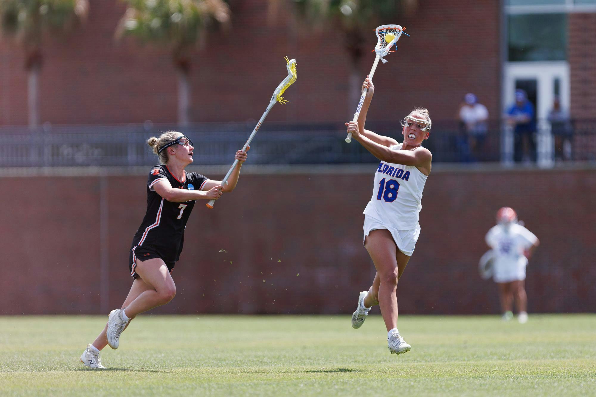 Florida defender Sam Hughes (18) passes downfield during the second quarter of an NCAA women’s lacrosse gmae against Mercer, Saturday, March 07, 2026, in Gainesville, Fla.