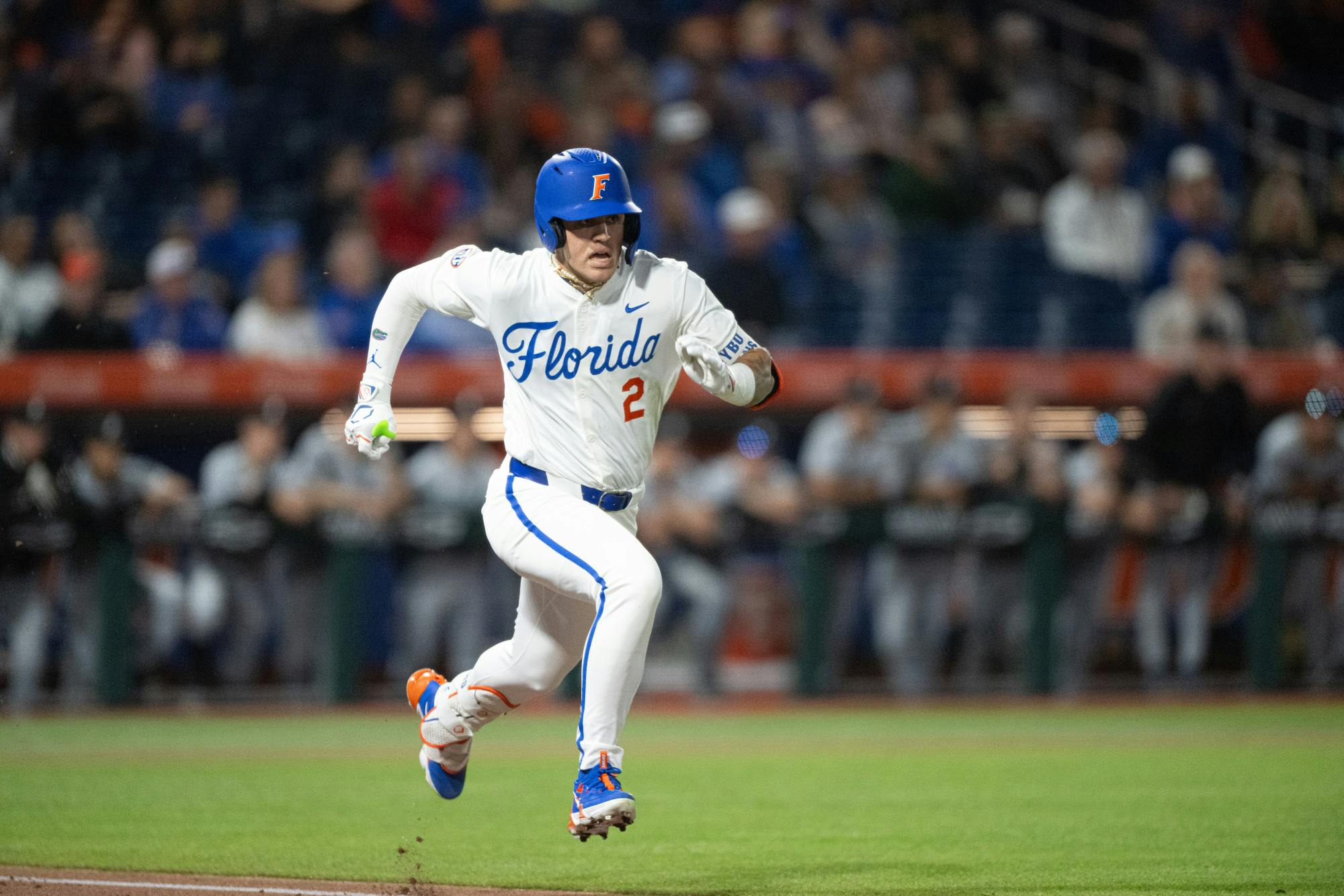 Florida Gators outfielder Ty Evans (2) sprints to first base in a baseball game against the Air Force Academy in Gainesville, Fla., on Friday, Feb. 14, 2025.