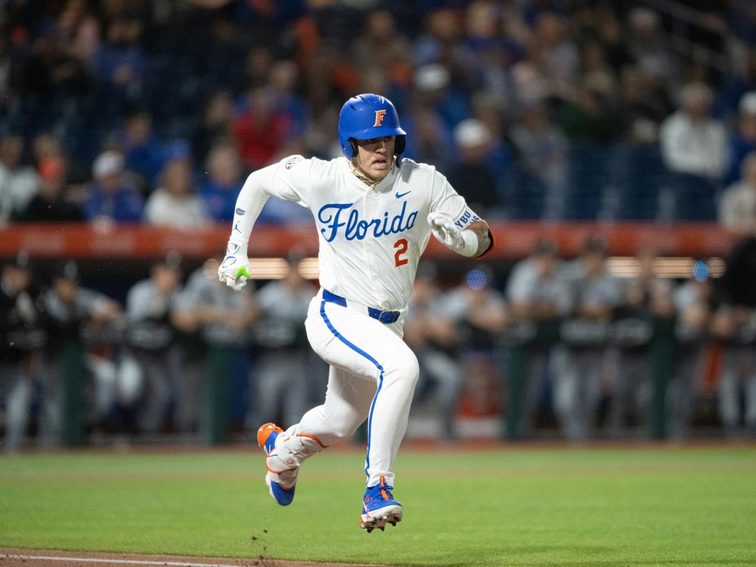 Florida Gators outfielder Ty Evans (2) sprints to first base in a baseball game against the Air Force Academy in Gainesville, Fla., on Friday, Feb. 14, 2025.