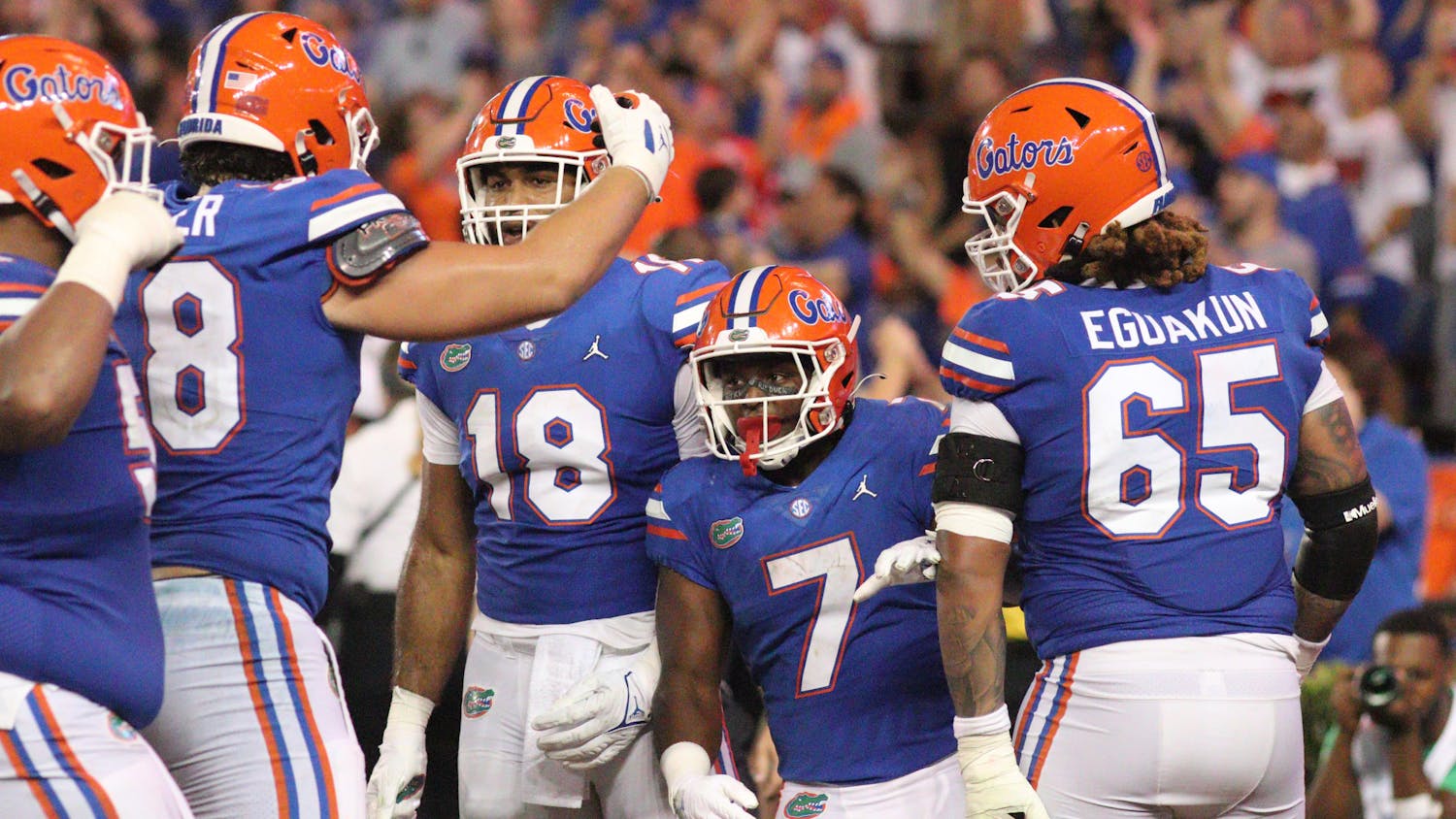 Florida freshman running back Trevor Etienne celebrates a late game touchdown with his offensive line during the Gators' game against South Florida Saturday, Sept. 17, 2022. 