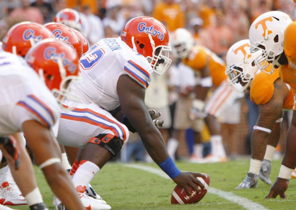 <p align="justify">Redshirt senior center Jon Harrison prepares to snap the ball against Tennesee on Sept. 15 in Neyland Stadium. Florida scored 24 unanswered points to win the game 37-20.</p>