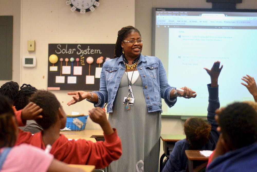 [FILE PHOTO] 35-year-old Lilliemarie Gore leads students of Idylwild Elementary School through a series of math exercises. Mrs. Gore was awarded the title of "2017-2018 Alachua County Teacher of the Year" earlier this month. 