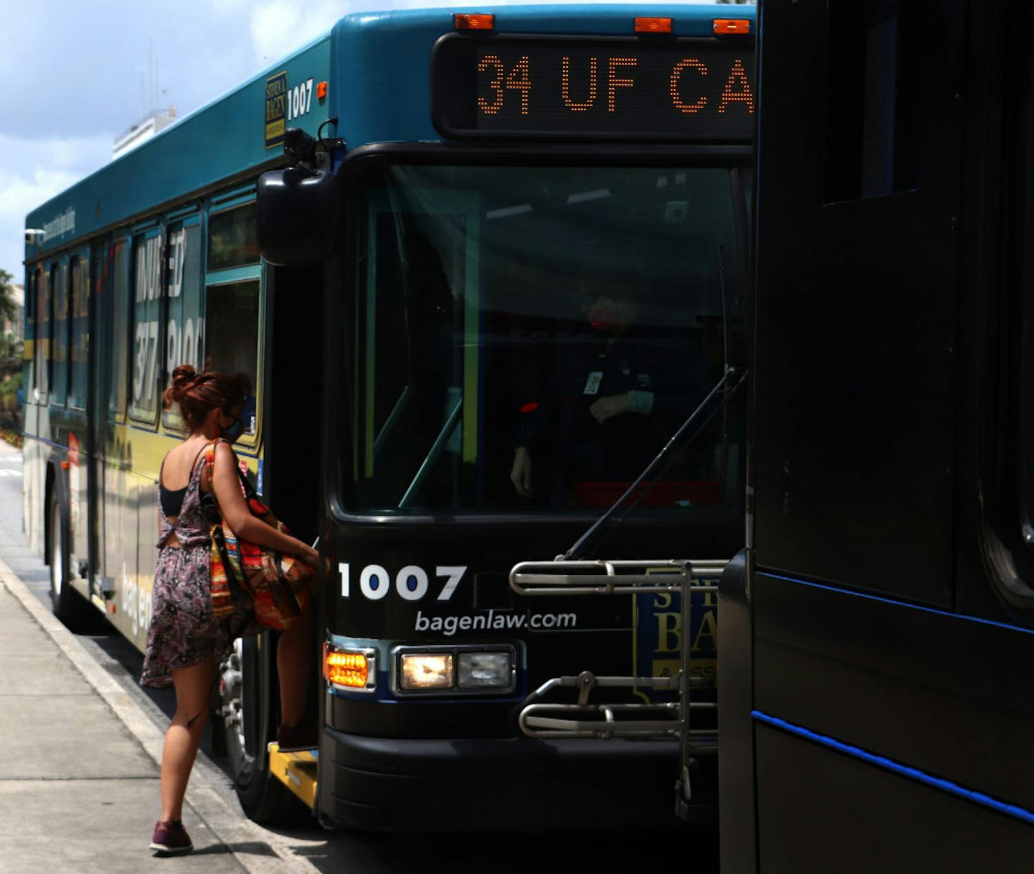 UF first-year interdisciplinary ecology PH.D. student, Natalia Uribe, 29, boards RTS bus No. 34 on Wednesday, September 2, 2020. Uribe said she thinks the buses are safe and that not many people are using them.