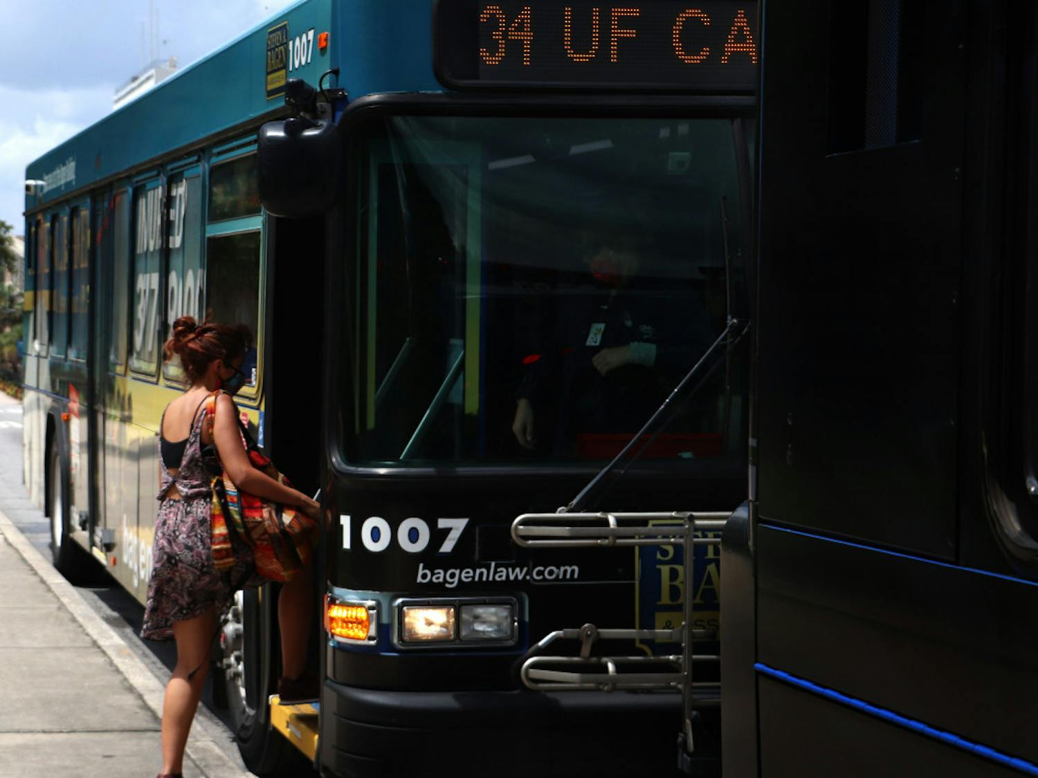 UF first-year interdisciplinary ecology PH.D. student, Natalia Uribe, 29, boards RTS bus No. 34 on Wednesday, September 2, 2020. Uribe said she thinks the buses are safe and that not many people are using them.