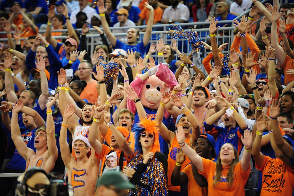 <p>Gators fans cheer during No. 19 Florida's 67-61 win against No. 13 Kansas on Dec. 10 in the O'Connell Center.</p>