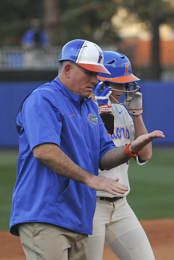 Tim Walton talks with Taylor Schwarz during Florida's doubleheader sweep of Jacksonville on Feb. 17, 2016, at Katie Seashole Pressly Stadium. 