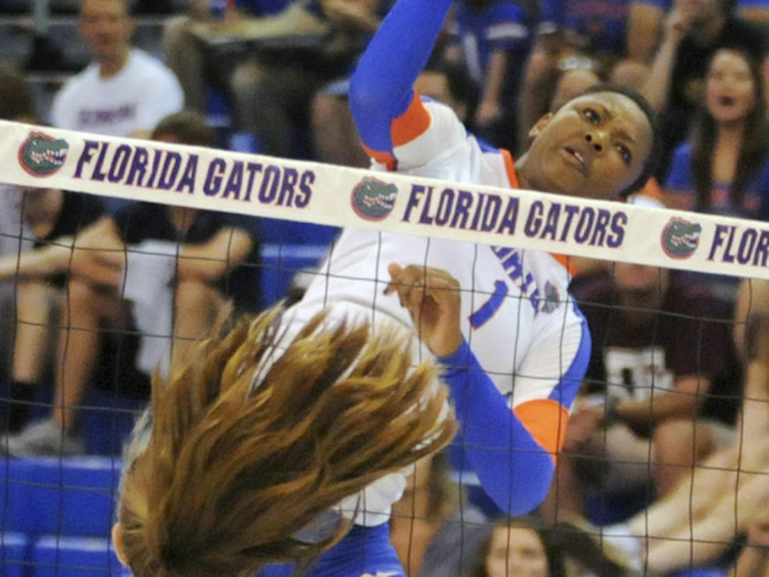UF middle blocker Rhamat Alhassan swings for a kill attempt during Florida's 3-0 win against Texas A&M on Oct. 3, 2015, in the O'Connell Center.