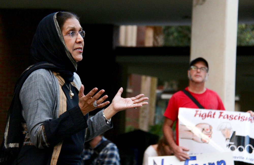 Indian-American immigrant Aqueela Khuddus, 63, explains to a group of about 30 people how welcoming Americans were when she emigrated to the U.S. about 50 years ago. The director of a nonprofit organization, the Khadija Foundation, was one of five speakers at the Rally Against Fascism and Xenophobia held on the Plaza of the Americas on Monday night.