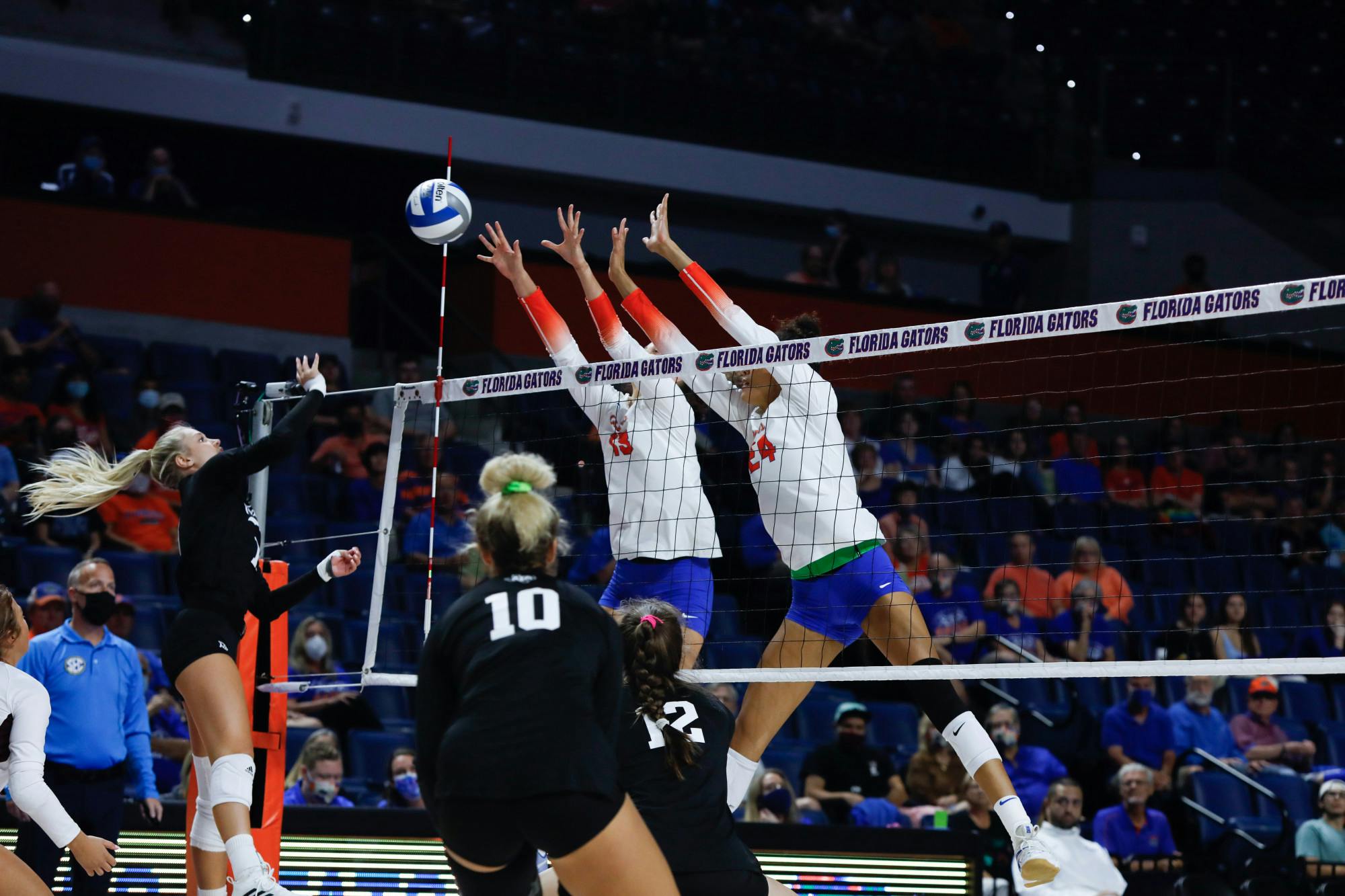 Florida volleyball's Merritt Beason (13) and Lauren Forte (24) go up for a block in a game against Texas A&M on Oct. 16.