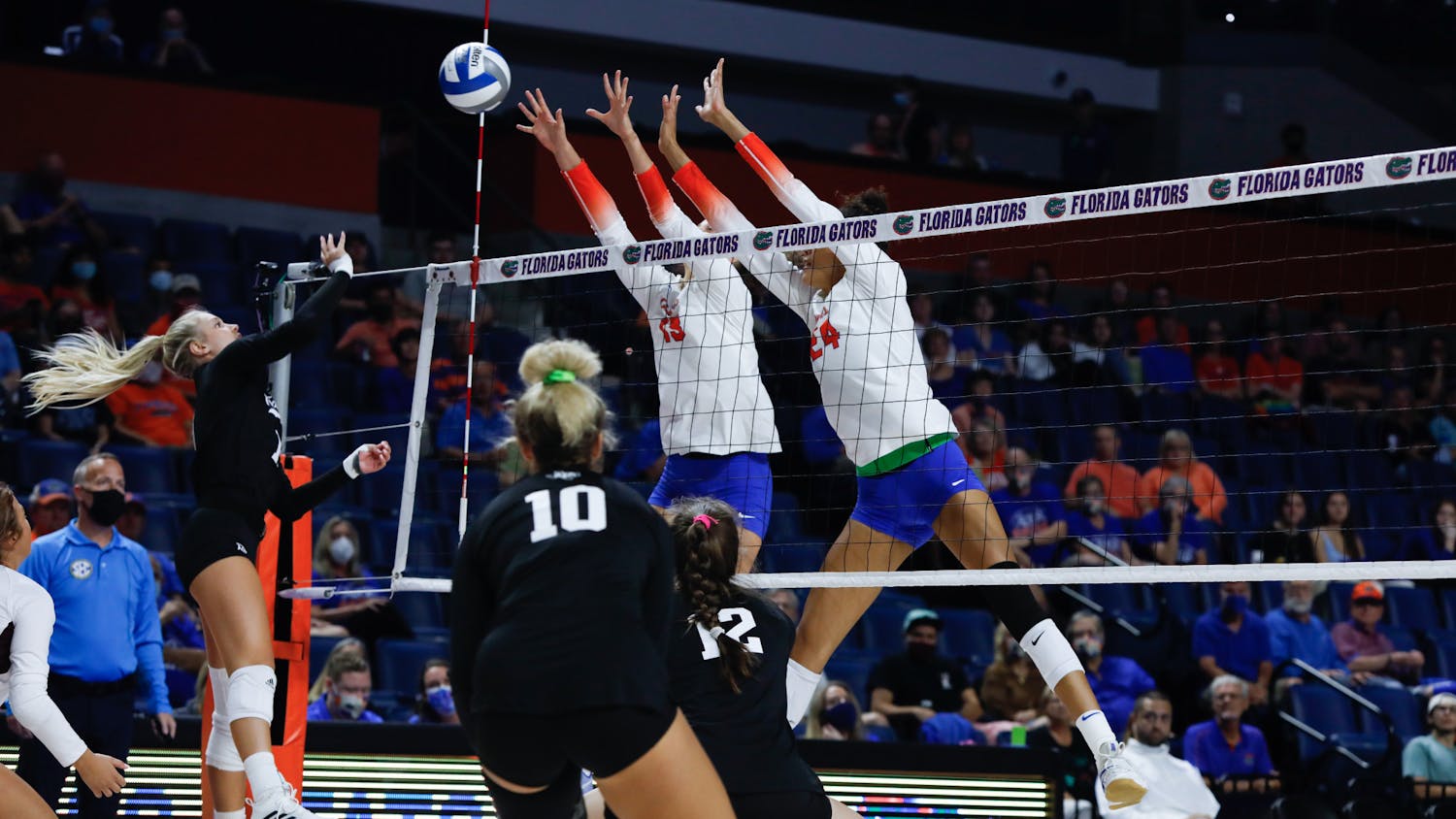 Florida volleyball's Merritt Beason (13) and Lauren Forte (24) go up for a block in a game against Texas A&M on Oct. 16.