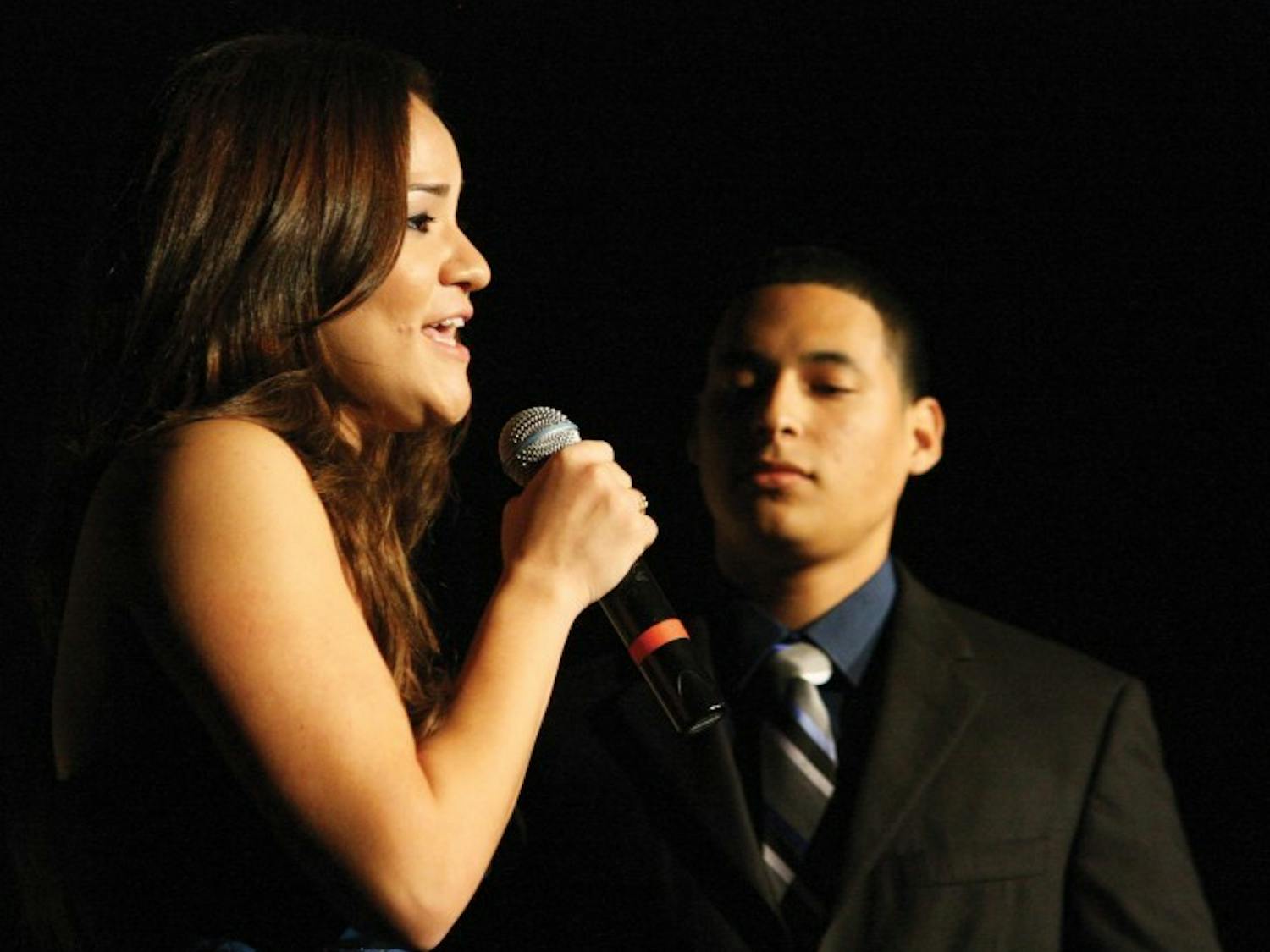 Mistress and master of ceremonies Jennise Acosta and Alex Castro introduce the acts for the Hispanic Heritage Month Talent Show in the Reitz Union Grand Ballroom Wednesday night.