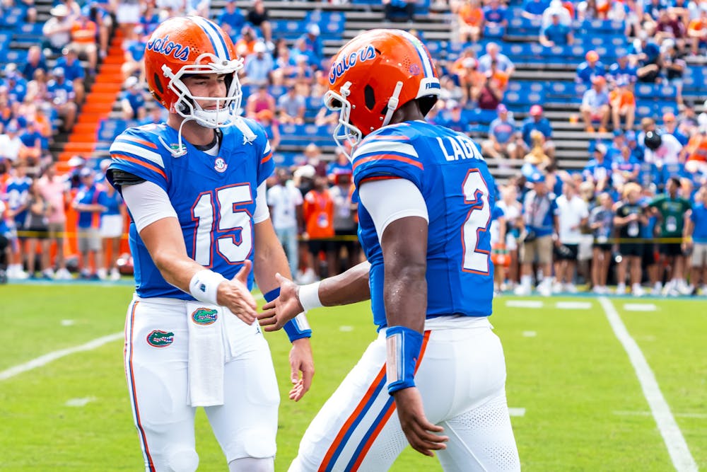 <p>Florida quarterbacks Graham Mertz and DJ Lagway high five one another before the start of the Gator game against Texas A&amp;M on Saturday, Sept. 14, 2024. </p>