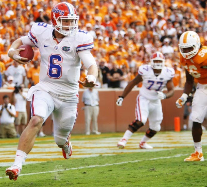 Florida quarterback Jeff Driskel (6) escapes pressure on Saturday during the Gators' 37-20 victory over Tennessee on Saturday at Neyland Stadium.
