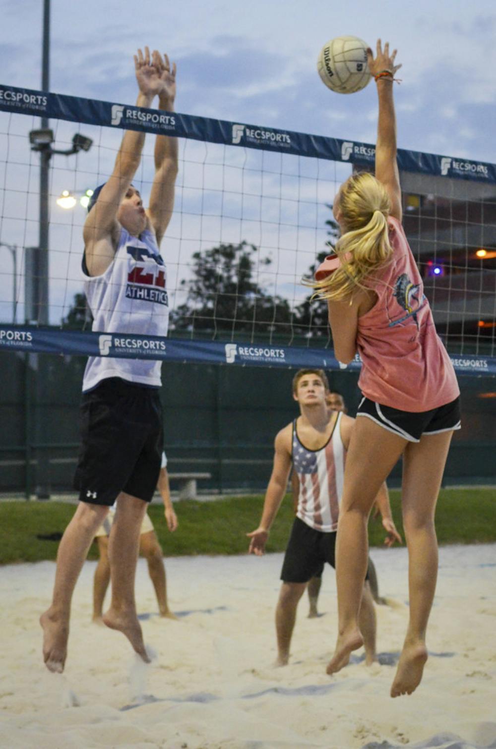 <p class="p1">Drew Baker, a 20-year-old UF economics major, prepares to block a spike from 20-year-old aerospace engineer major Shanna Wyatt. The volleyball game was part of “Spike-it-with-Senate,” a charity volleyball tournament.</p>