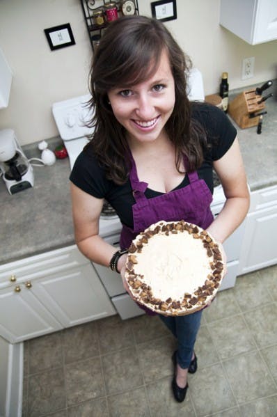 Becca Goldring, 21-year-old UF student athlete on the Gators track and field team, holds up a peanut butter pie, a Becca Bakes treat she made for a friend's birthday.