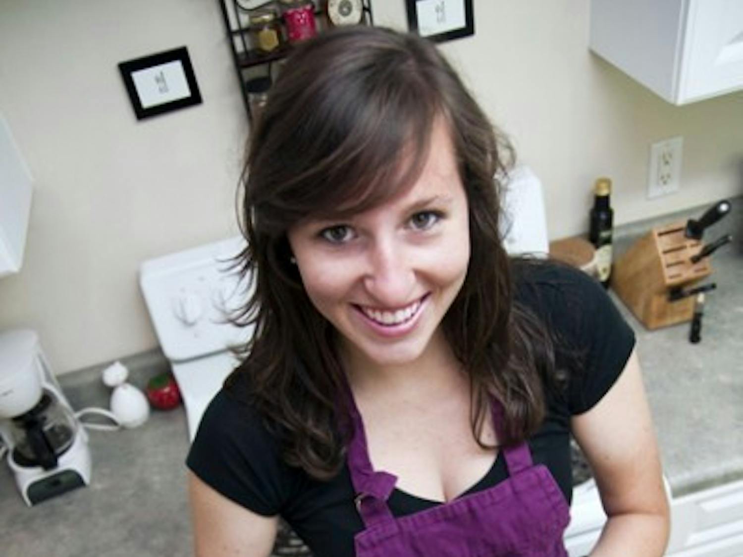 Becca Goldring, 21-year-old UF student athlete on the Gators track and field team, holds up a peanut butter pie, a Becca Bakes treat she made for a friend's birthday.