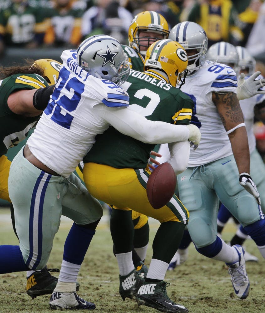 Dallas Cowboys defensive end Jeremy Mincey (92) causes Green Bay Packers quarterback Aaron Rodgers (12) to fumble during the Cowboys' loss on Sunday.