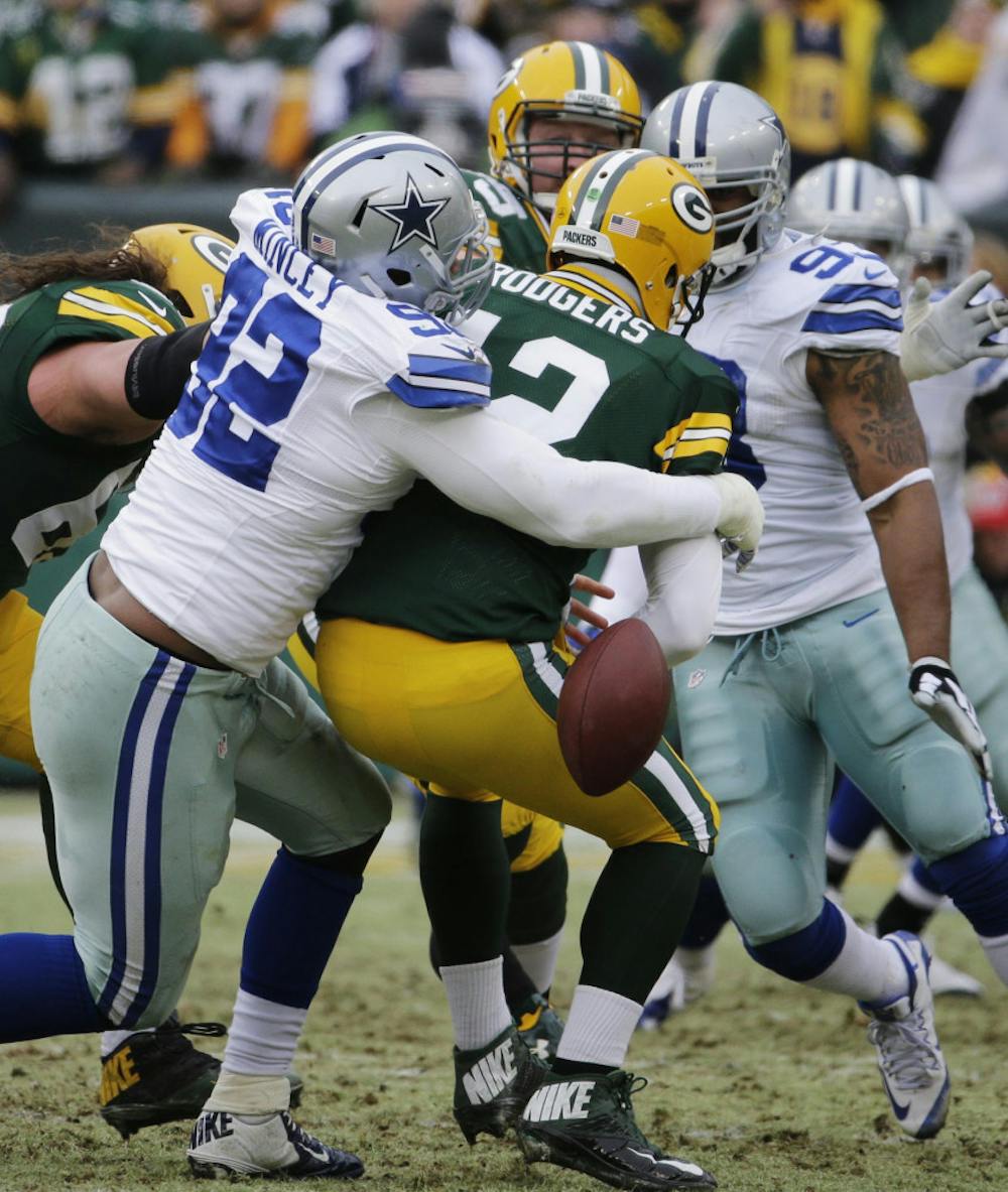 <p>Dallas Cowboys defensive end Jeremy Mincey (92) causes Green Bay Packers quarterback Aaron Rodgers (12) to fumble during the Cowboys' loss on Sunday.</p>