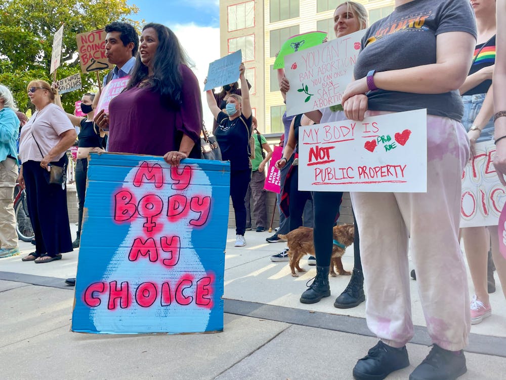 <p>More than 100 protesters stand outside a downtown Gainesville courthouse on Tuesday, May 3, 2022. They gathered to support abortion rights after reports the Supreme Court would overturn Roe v. Wade.</p>
