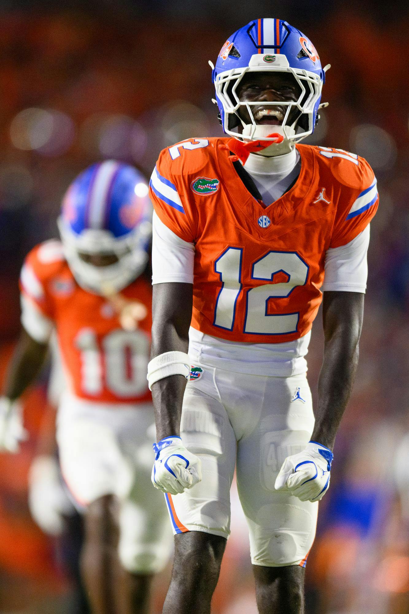 Florida cornerback Ben Hanks III (12) celebrates knocking down Campbell running back Taeshon Martin (24) during the second half of an NCAA college football game, Saturday, Sept. 12, 2026, in Gainesville, Fla.