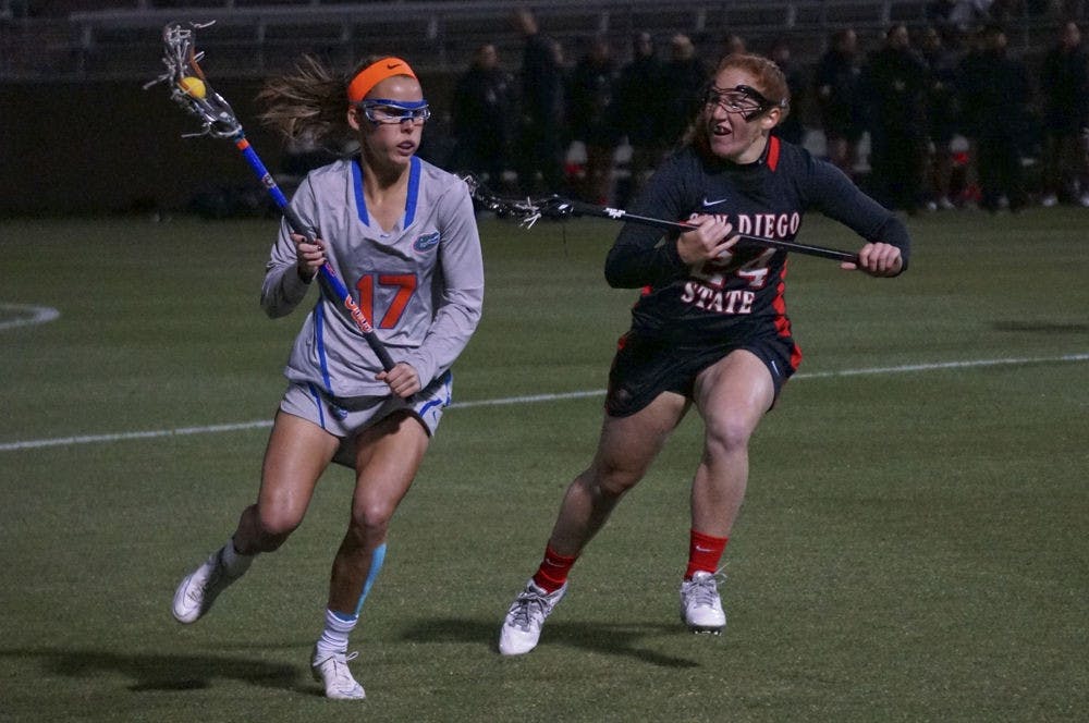 <p>UF midfielder Mollie Stevens runs toward the net during Florida's 17-7 win against San Diego State on Feb. 20, 2015, at Donald R. Disney Stadium.</p>